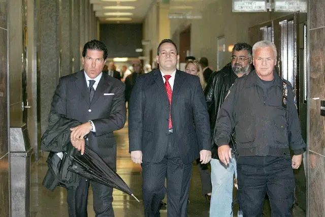 Hiram Monserrate, center, leaves court in 2009 after he was found guilty of misdemeanor assault.
